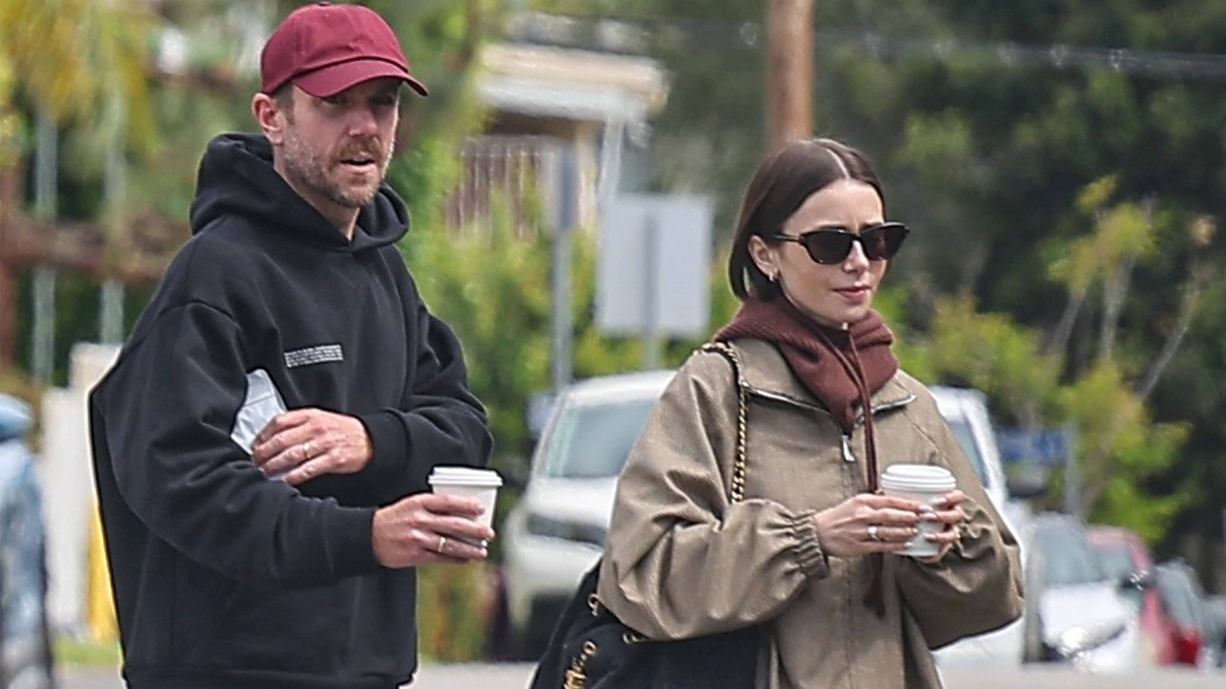 Lily collins wears a khaki jacket, chanel bag, and sunglasses.