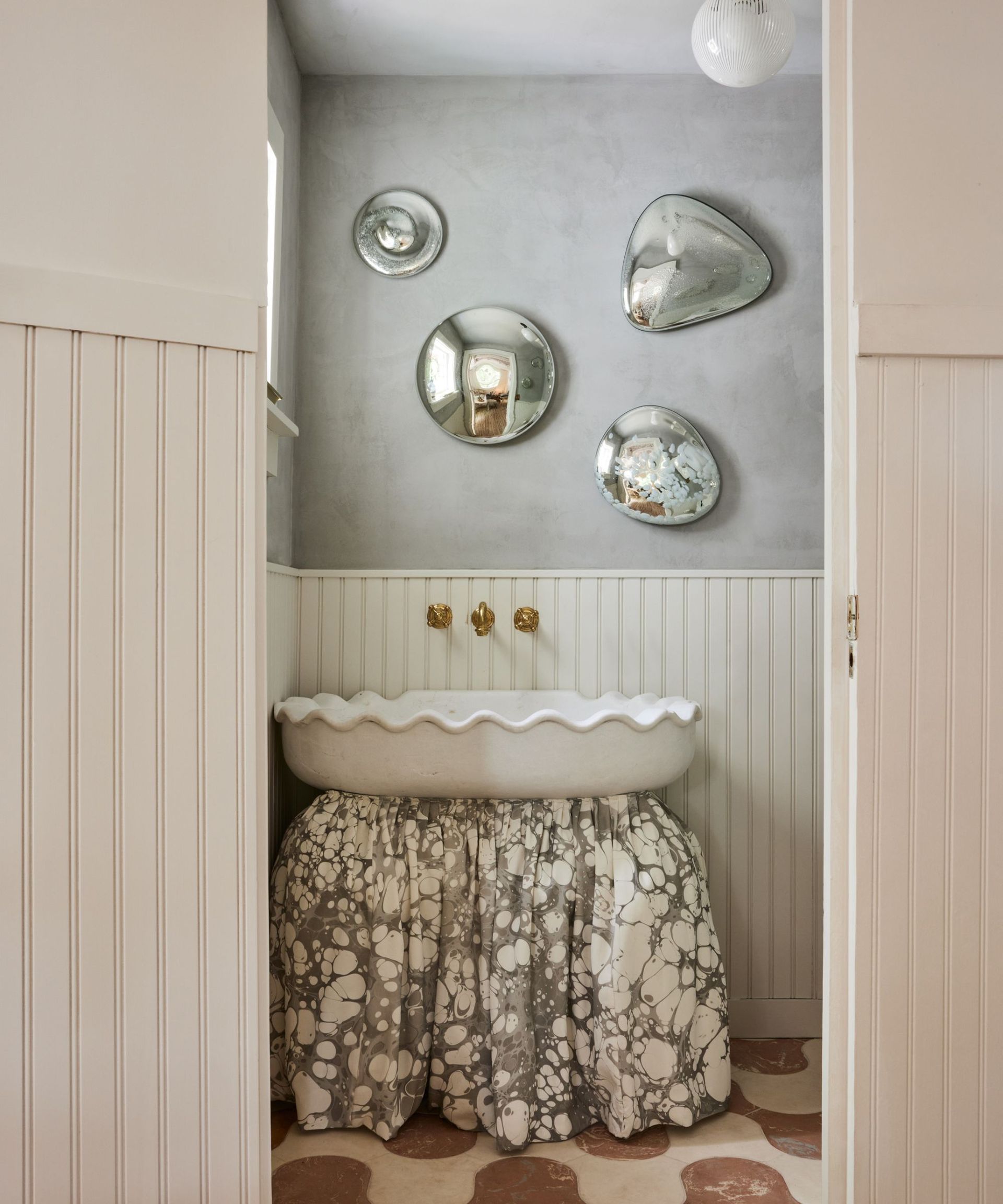 Brown and white tiled floor, white sink