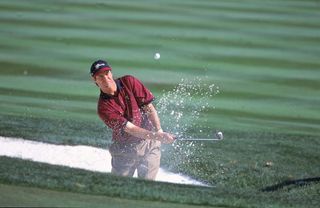 Paul Azinger plays a bunker shot