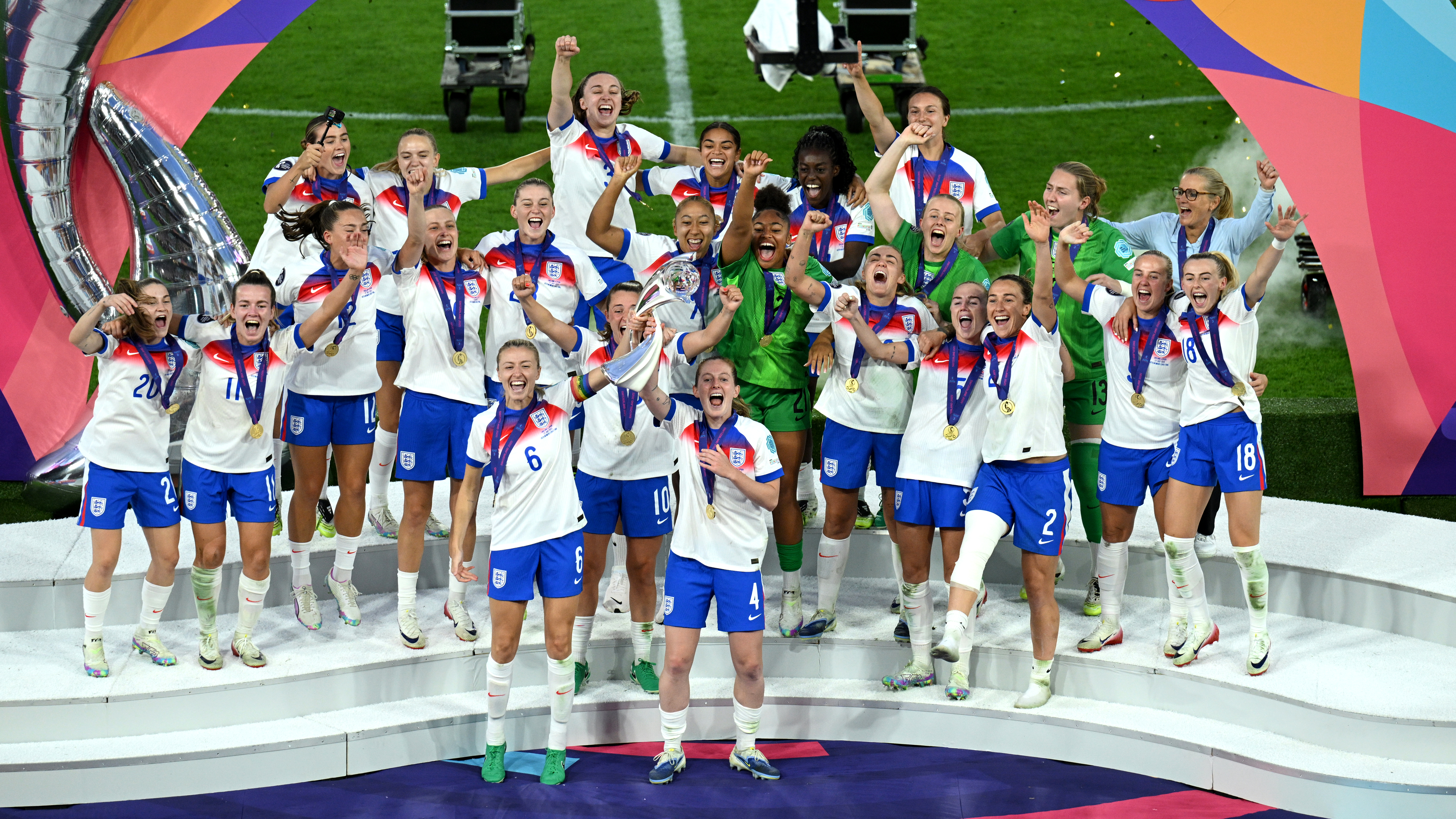 Leah Williamson and Keira Walsh of England lift the UEFA Women's EURO trophy after their team's victory in during the UEFA Women's EURO 2025 Final match between England and Spain at St. Jakob-Park on July 27, 2025 in Basel, Switzerland.