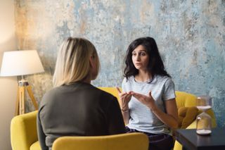 Women talking in coworking office