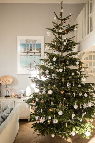 California style Christmas living room decor and large Christmas tree by Laura Butler-Madden