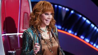 Reba McEntire reacts to a performance on The Voice Season 26 playoffs that aired on NBC on Monday, November 25, 2024.