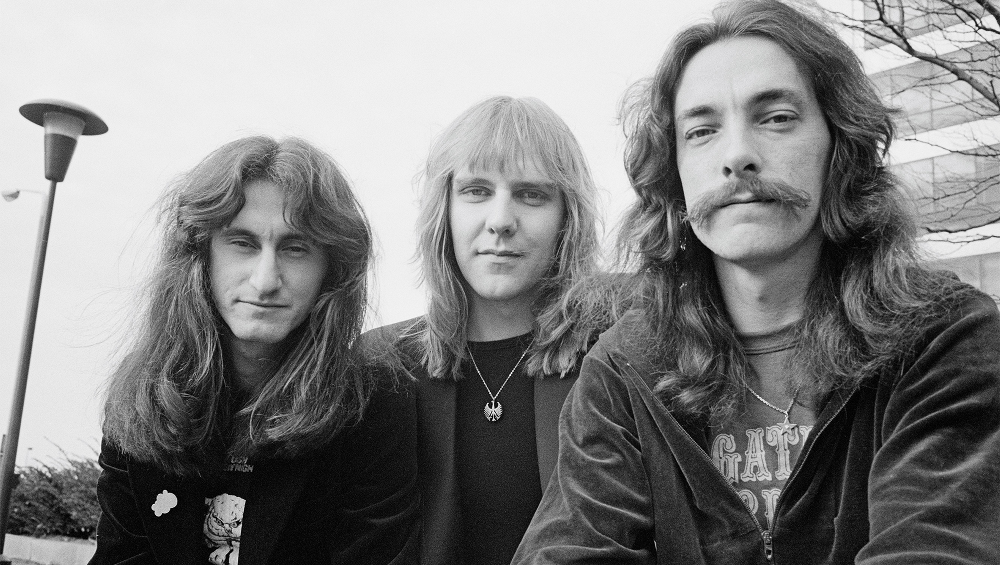 Bassist Geddy Lee, Guitarist Alex Lifeson and drummer Neil Peart from Canadian progressive rock band Rush posed in Cleveland, Ohio on 17th December 1977.