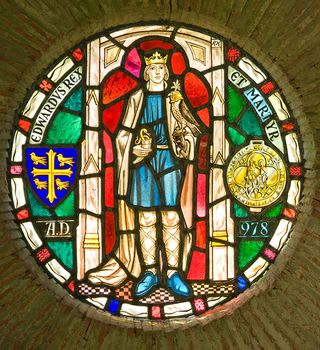 A stained glass roundel dedicated to King Edward the Martyr at Shaftesbury Abbey ruins in Dorset