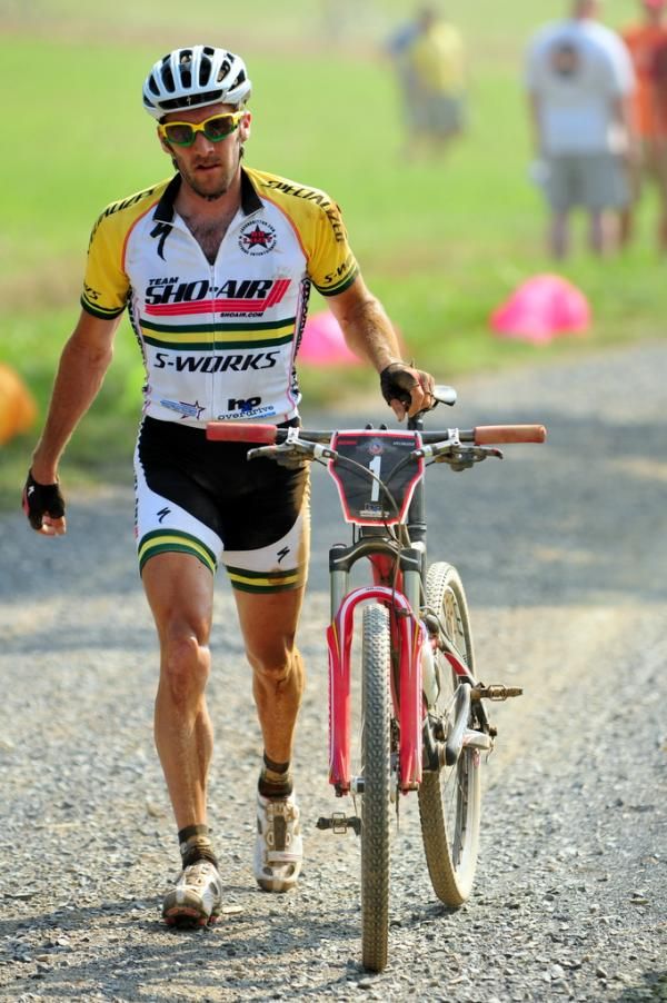 An unhappy Sid Taberlay (Sho-Air/Specialized) walks toward the line after his crash.
