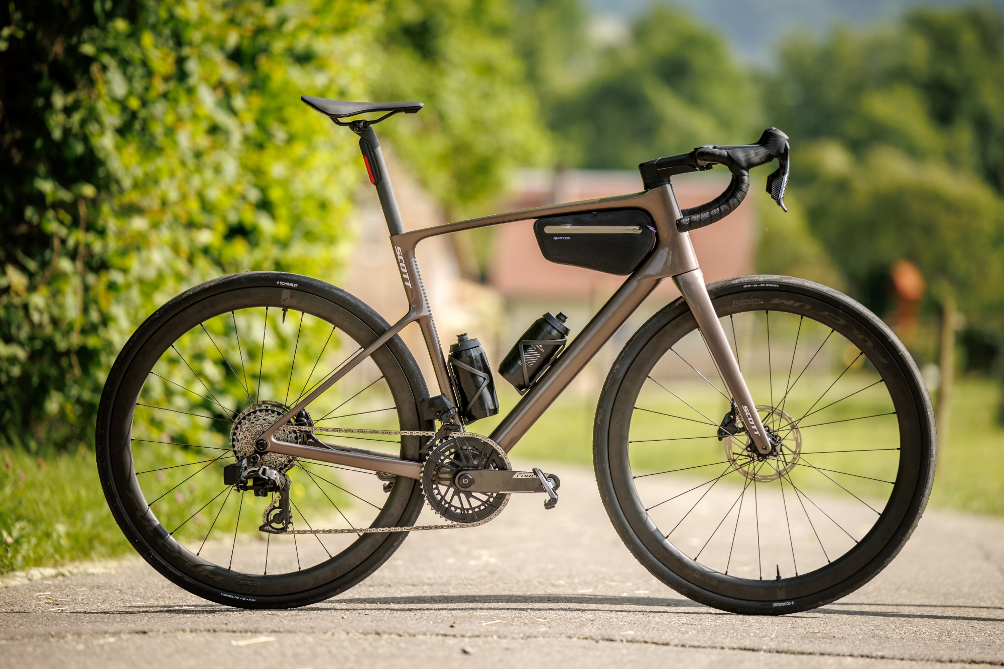 The Scott Addict 10 in full side on with bar bag and bottles