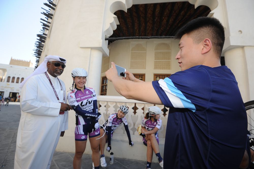 A China Chongming-Liv-Champion System rider takes souvenir photos