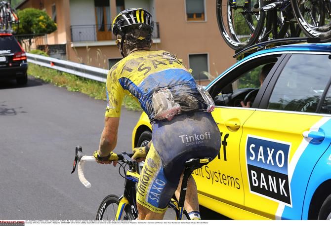 Kurt Asle Arvesen gets help from the TInkoff-Saxo car