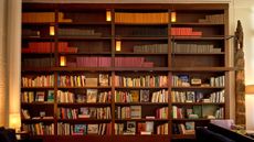 Shelves filled with books at The Mercer hotel library, New York