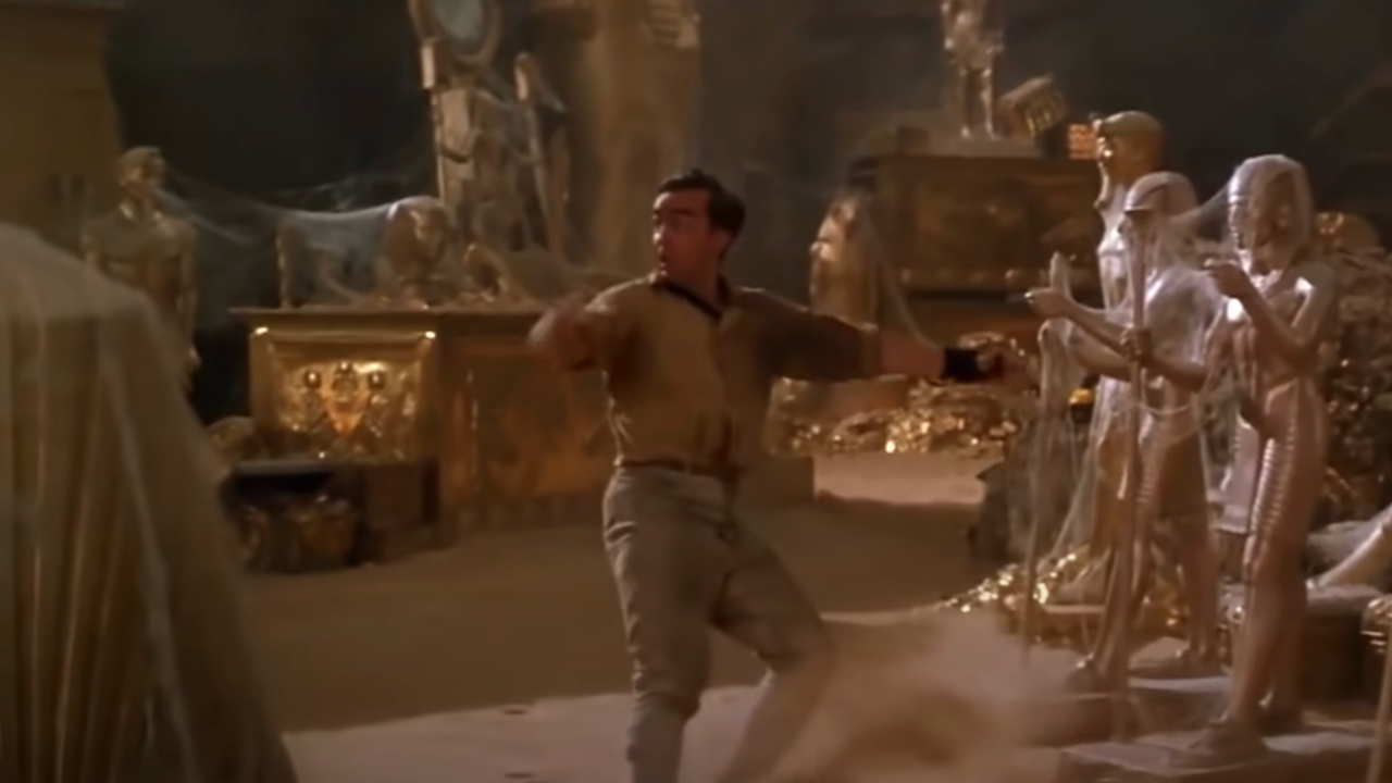 John Hannah slides to a stop in the treasure room of Hamunaptra in The Mummy.