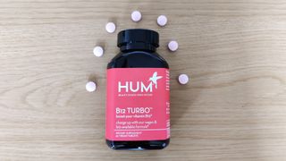 HUM Nutrition B12 Turbo pills and container on a table