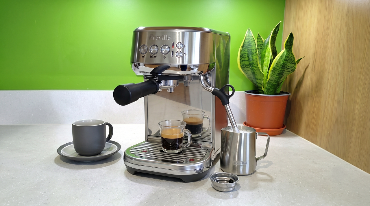 Breville Bambino Plus coffee maker on kitchen counter with house plant
