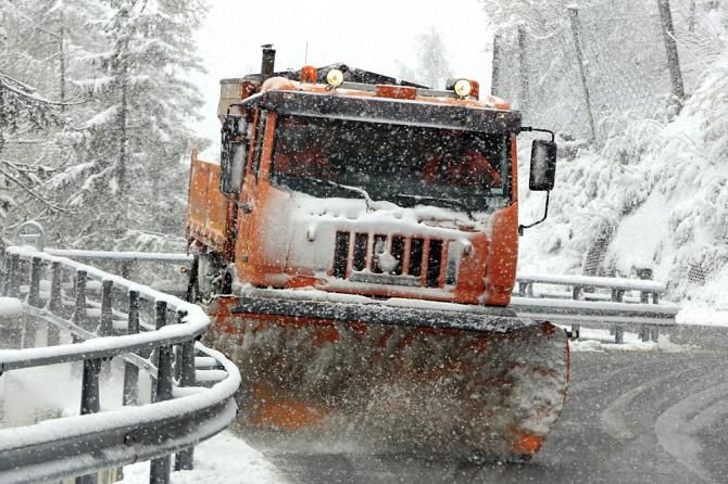 Plows removed the snow but it kept falling from the sky