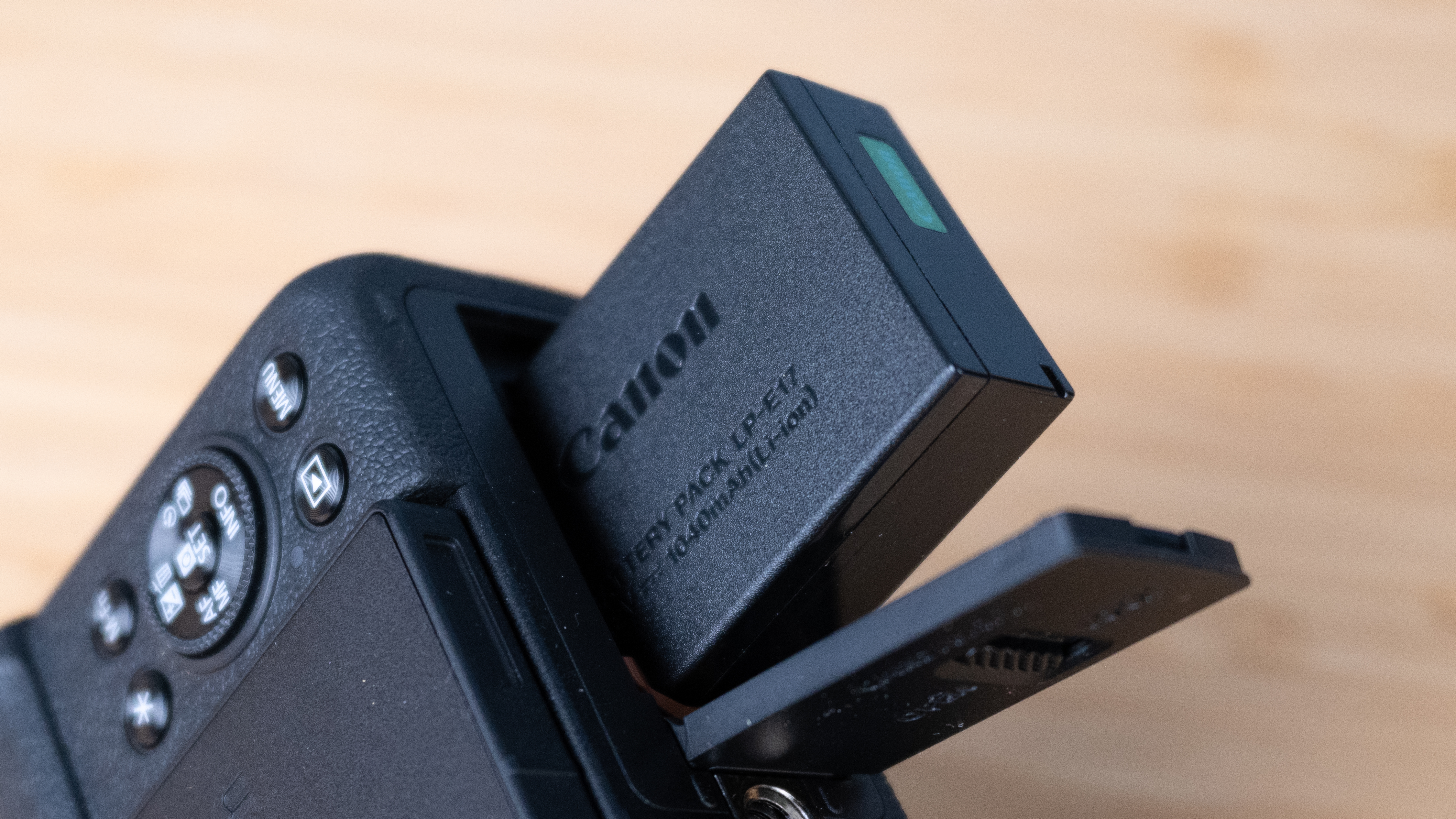 A black Canon PowerShot V1 compact vlogging camera