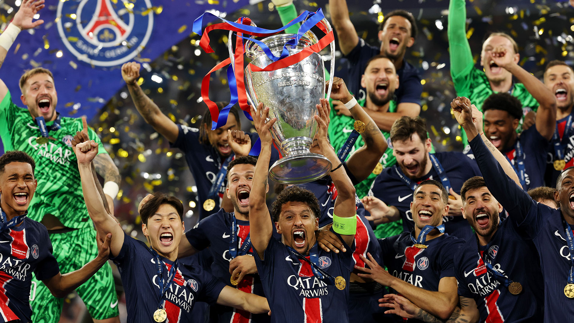 Marquinhos of Paris Saint-Germain lifts the UEFA Champions League trophy after Paris Saint-Germain&#039;s first ever title win
