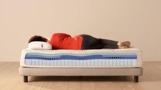 Casper Nova Hybrid review: A woman lies on her side on the Casper Nova Hybrid mattress