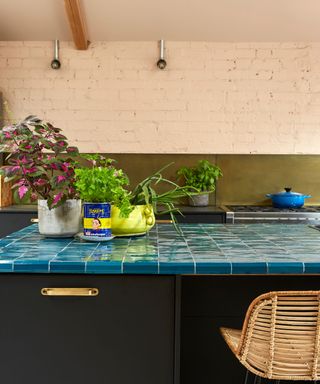 Peach kitchen with blue tiled kitchen island countertop