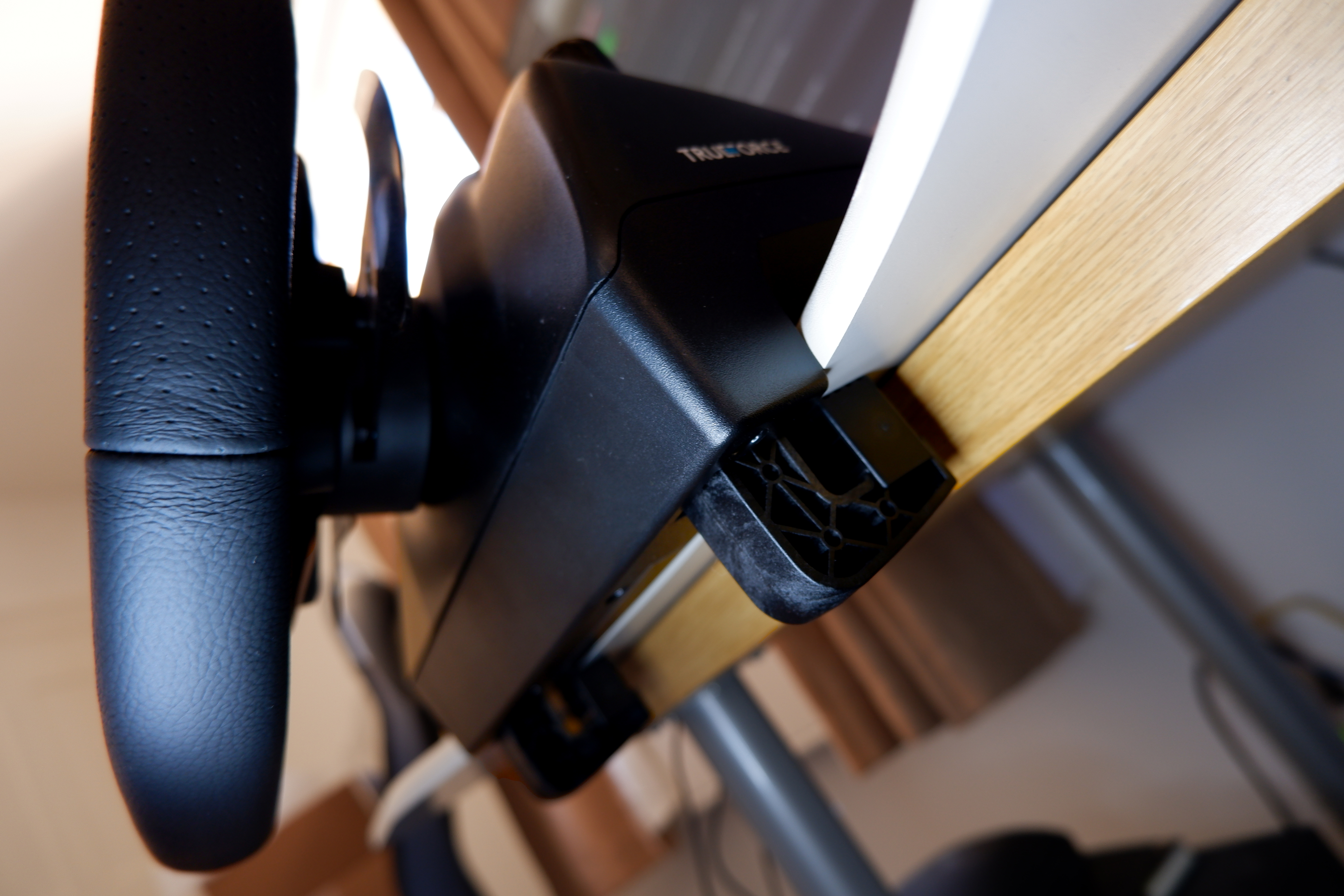 Logitech G923 racing wheel and pedals from various angles at a desk