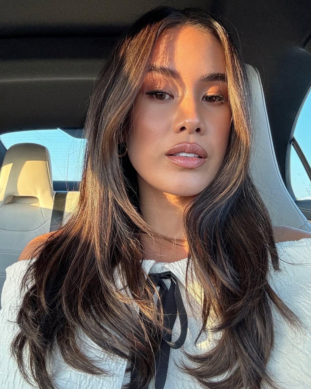 Jill Wallace wears peach blush on her cheekbones and nose bridge