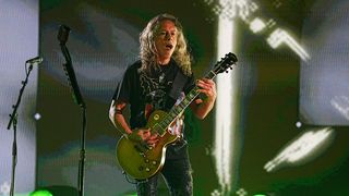 Kirk Hammett performs onstage