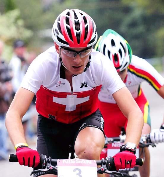 Reto Indergand (Switzerland) climbs with Marinheiro on his wheel.
