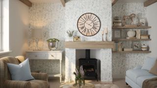 pretty living room with stove and floral wallpaper