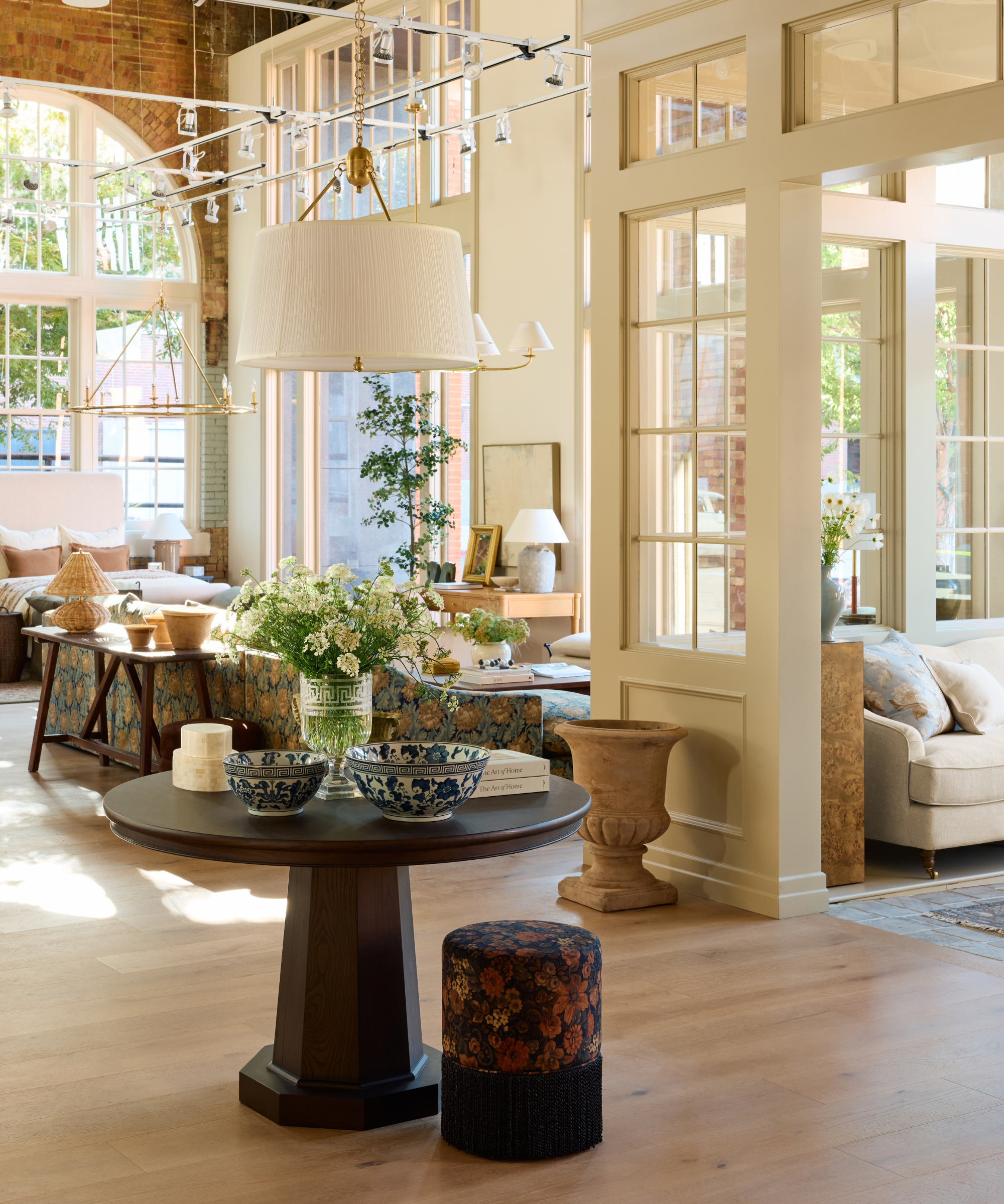 McGee &amp;amp; Co.'s sundrenched Salt Lake City flagship interior, featuring a layered mix of new and antique furniture