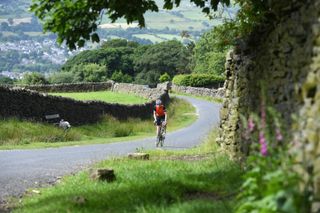 Male cyclist riding outside on a countrylane