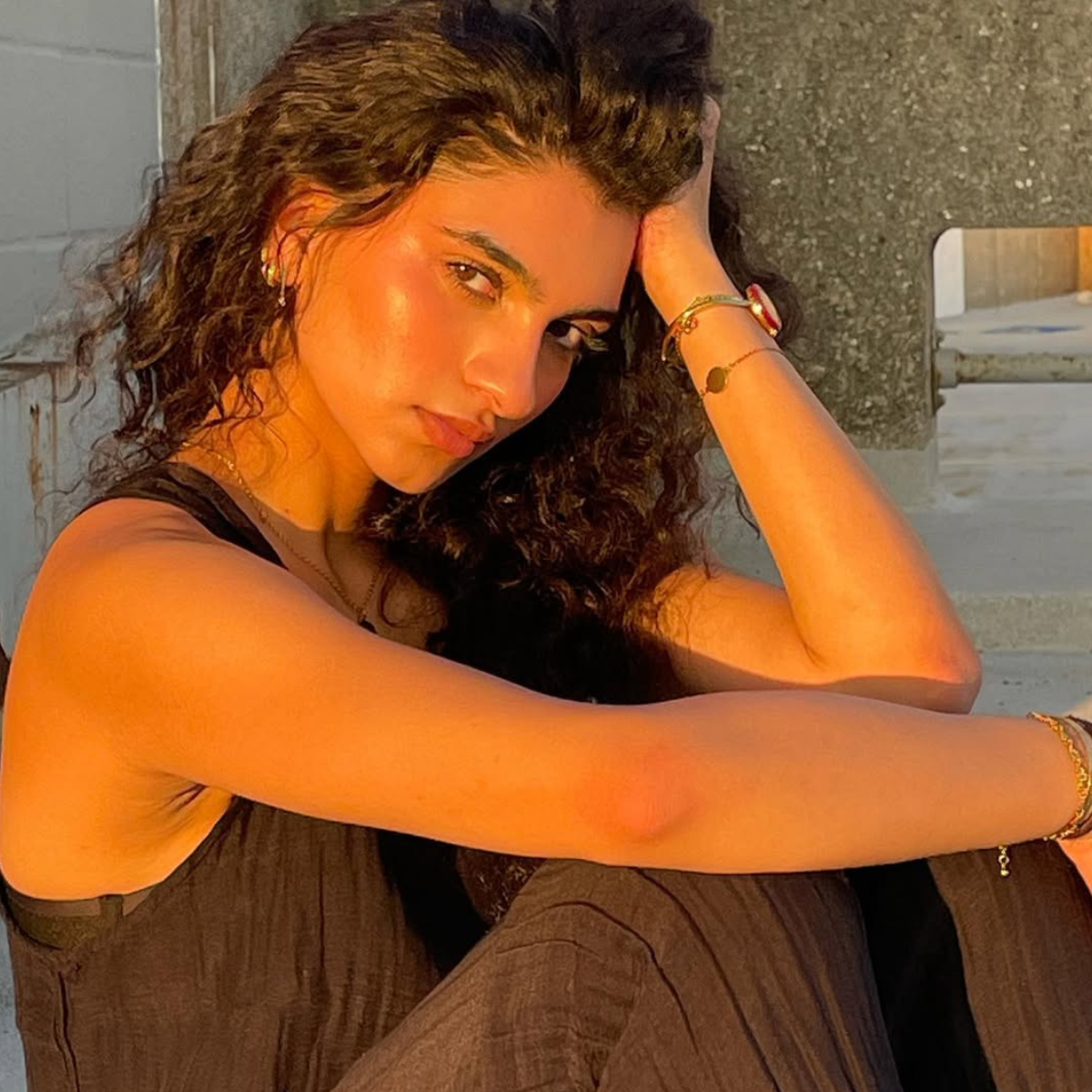 Mina Hasan wears the red bezel face on the Gucci Play Watch.