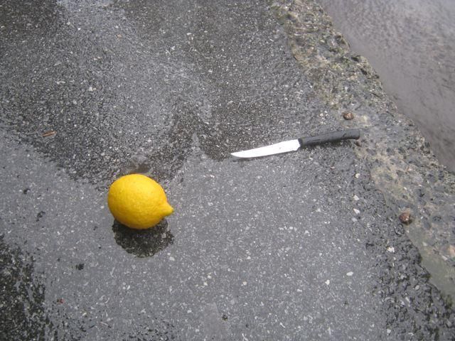 The lemon is an old trick to help braking in the rain.