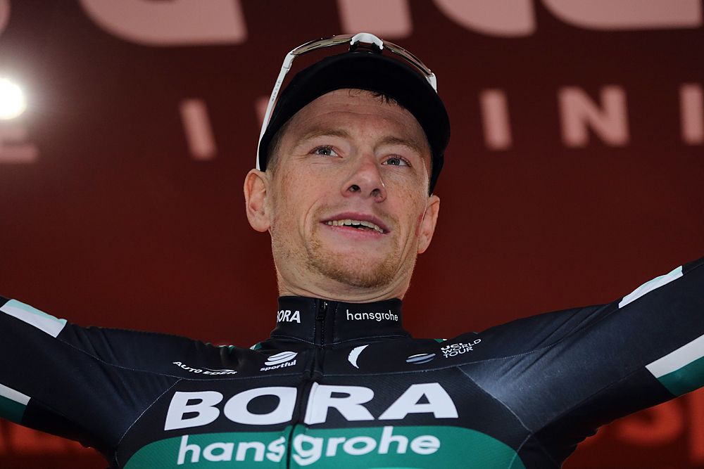 Sam Bennett (Bora-Hansgrohe) celebrates his stage 12 win on the podium at the Giro d'Italia