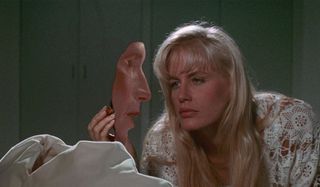 Memoirs of an Invisible Man Daryl Hannah puts make up on an invisible Chevy Chase.