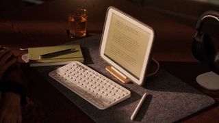 The Daylight DC-1 tablet sitting on a desk next to a keyboard