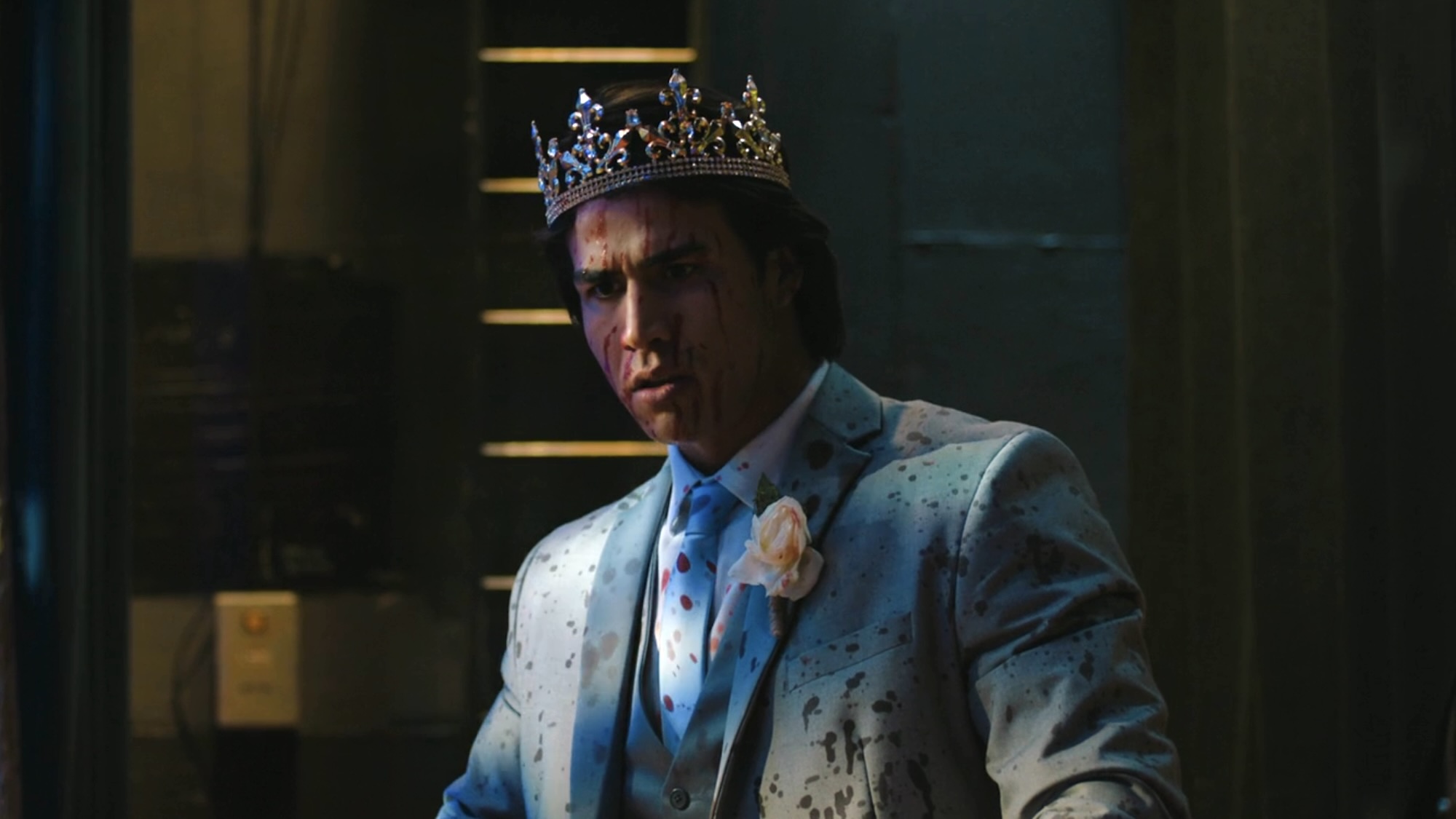 Tommy in his crown and tux covered in blood for Carrie's season finale.