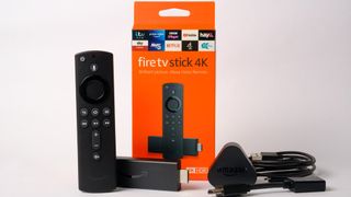 Contents of Amazon Fire TV Stick box, including remote, Fire Stick, plug and cables