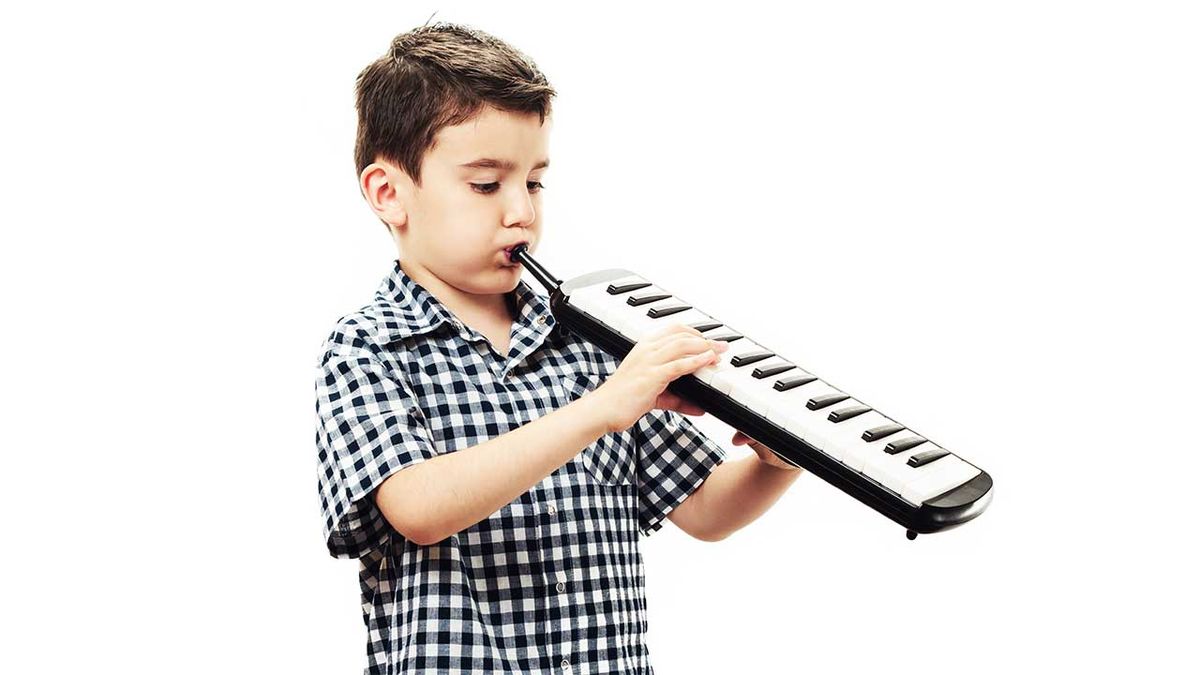 A child playing a melodica