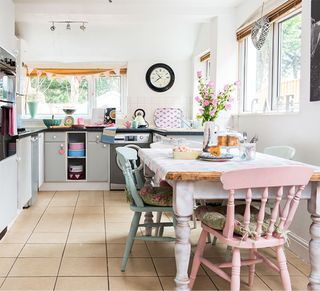 shabby chic kitchen with pastel painted chairs and table