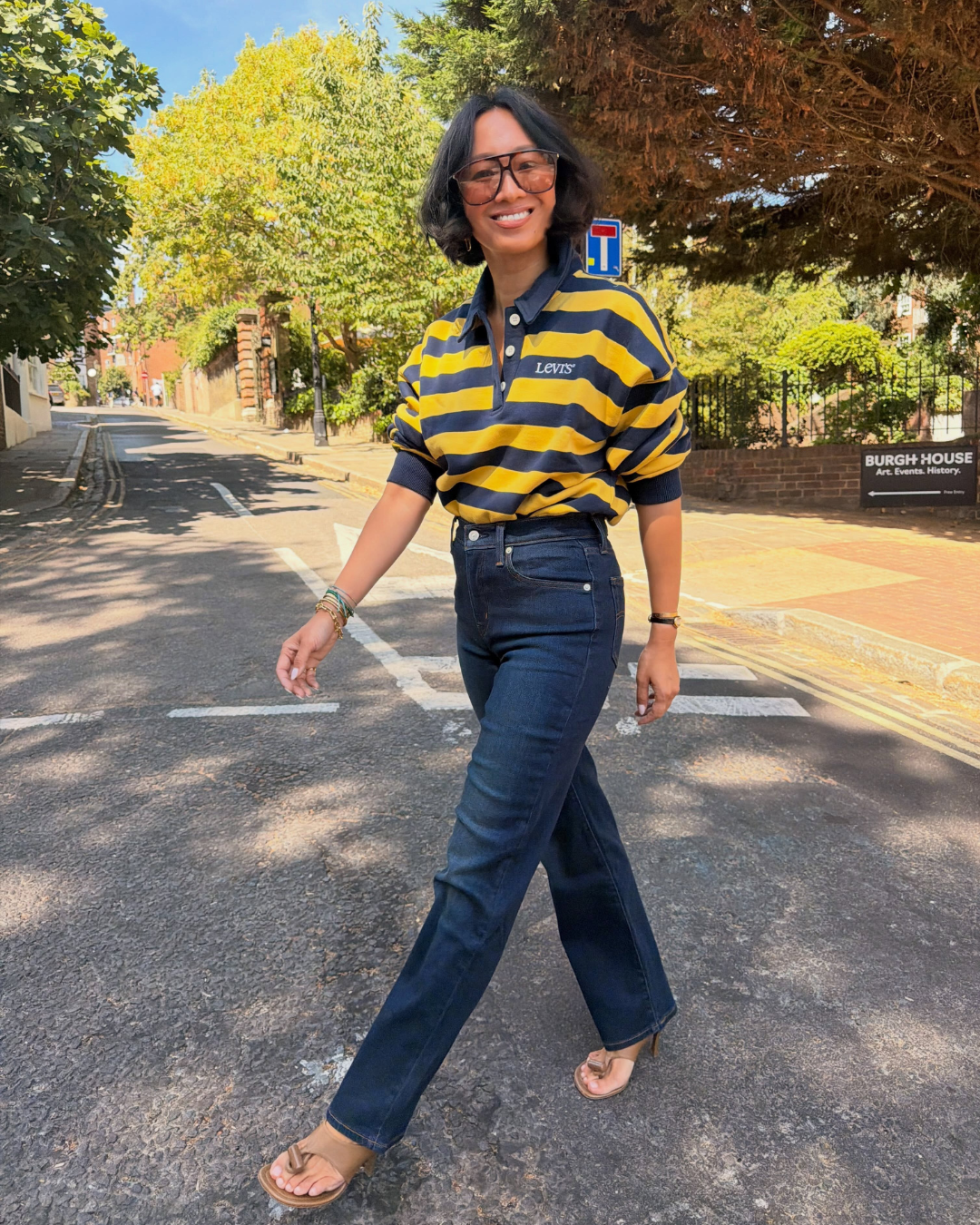 Lisa ing marinelli in dark denim jeans and stripe top.