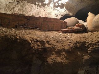 The remains of wooden coffins, a mummy mask and pottery were found inside the goldsmith's tomb.