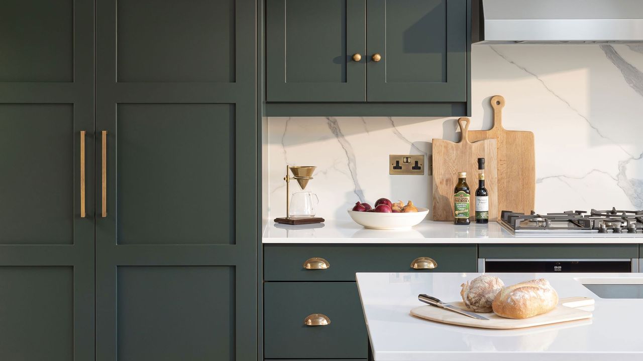 Green kitchen with white counters