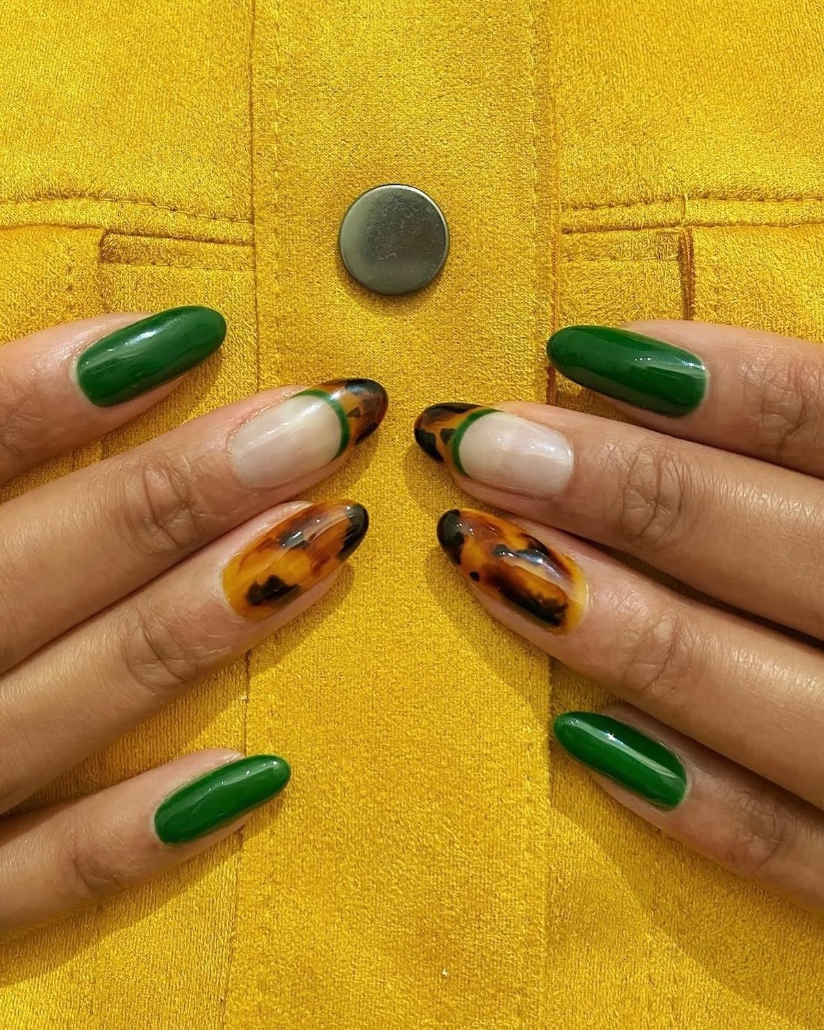 Dark green and tortoiseshell manicure