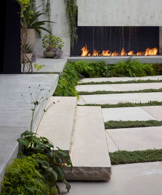 fire feature in modern backyard by Surfacedesign