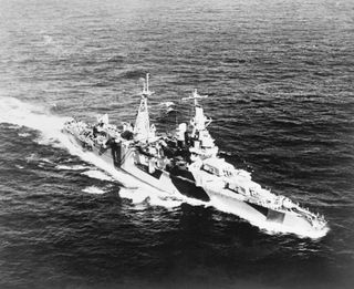 Black and white image showing the USS Indianapolis, a Navy cruiser, sailing in the sea