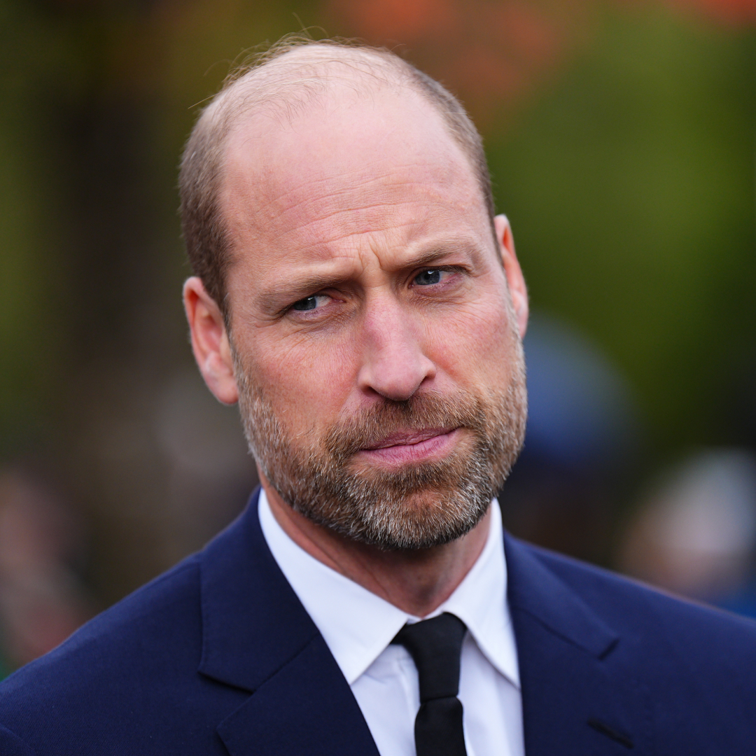 Prince William wearing a blue suit and tie