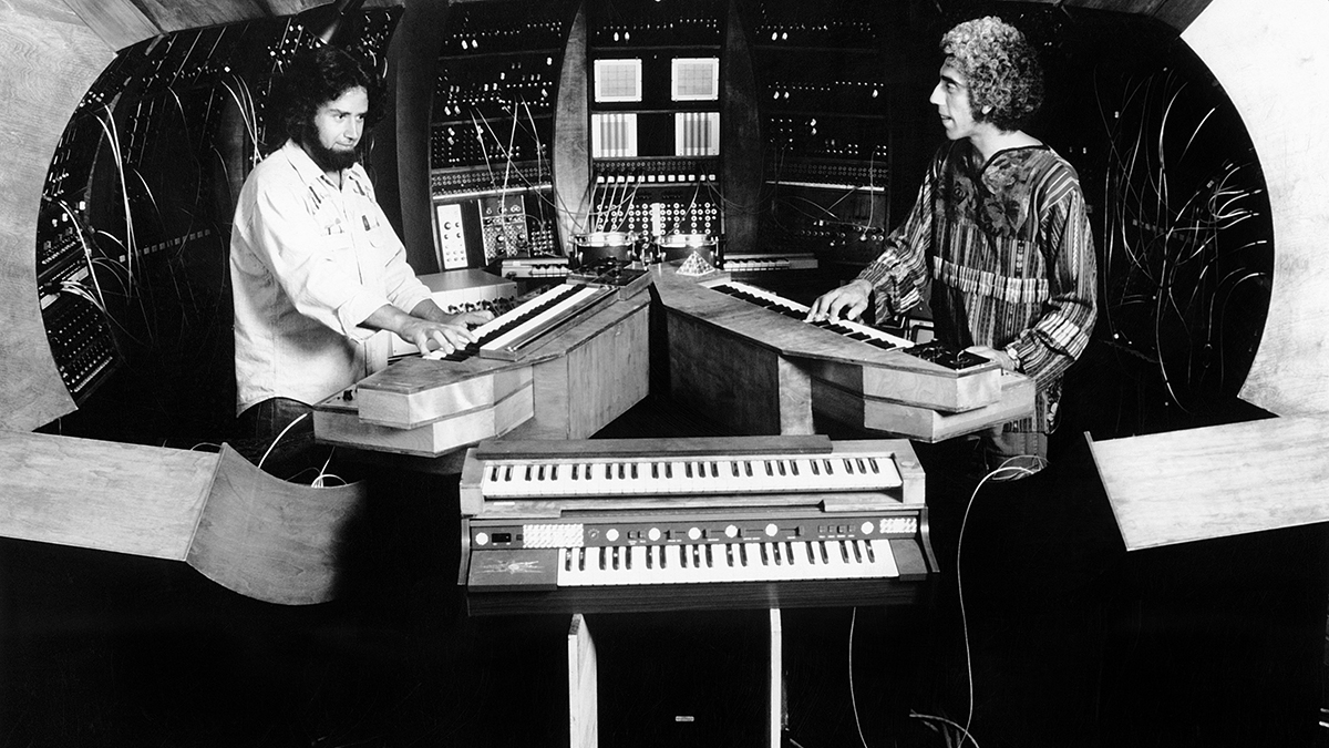 CIRCA 1974: British jazz bassist Malcolm Cecil (right) and American producer Robert Margouleff of the pioneering electronic music duo TONTO aka Tonto's Expanding Head Band (Tonto stands for The Original New Timbral Orchestra) perform live circa 1974. (Photo by Michael Ochs Archives/Getty Images)