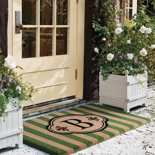 front porch with green doormat