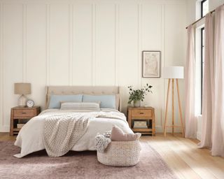 bedroom with warm white panelled walls, blush rug and curtains, cozy neutral bedding