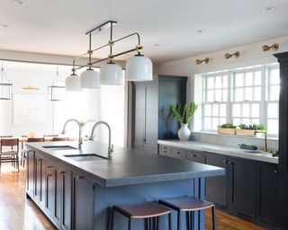 grey kitchen cabinets with kitchen island pendant lighting by Melinda Kelson