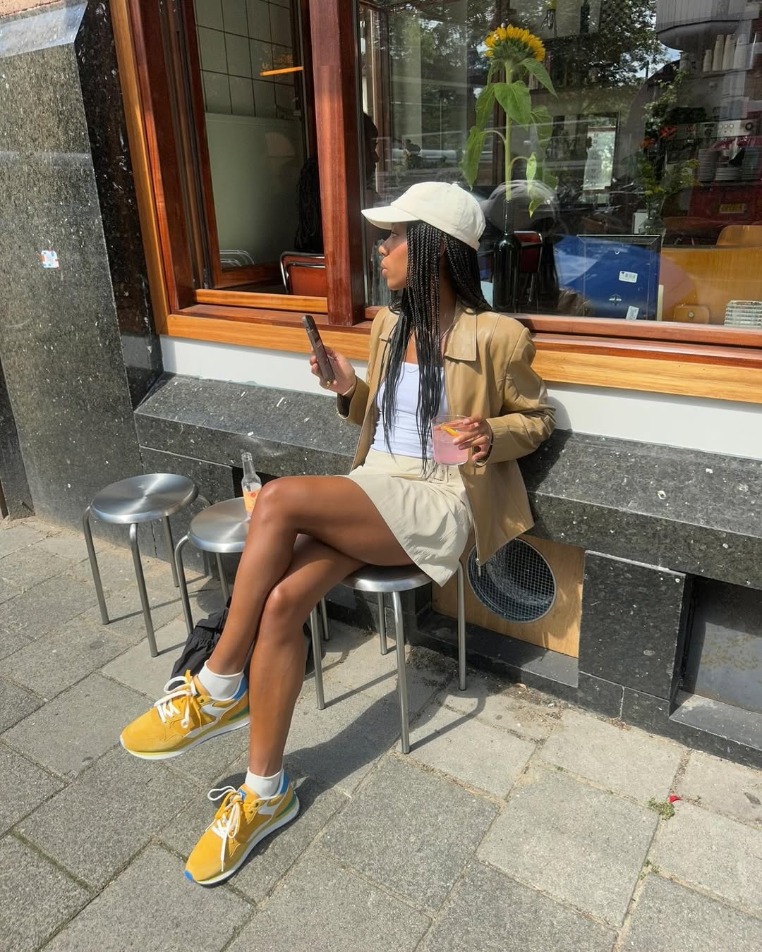 Woman wearing camel colored clothing summer 2025